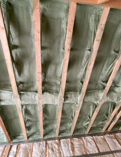 Spray Foam Insolation installed in a small room. Well coted insolation for walls, ceilings and more.